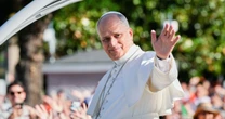1 million people flood Madrid streets to see the pope’s flower-carpeted procession