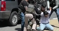 Immigration agents break SUV window while detaining man after church on Mother's Day