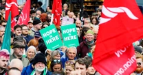 Thousands rally in Belfast to condemn anti-immigrant rioting that followed stabbing