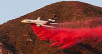 What is the pink powder sprayed over the California wildfires?