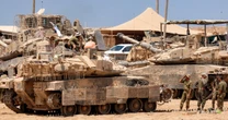 Satellite images show Israel building up forces for a possible ground invasion of Gaza, sources say