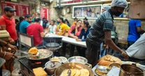 Indians line up for these flatbreads. But now gas is running short.