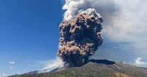Sicily's Mount Etna erupts in a fiery show of smoke and ash miles high