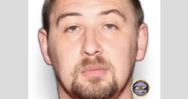 Relative of 4 found dead in Tennessee says her family 'trusted' murder suspect who is on the run 