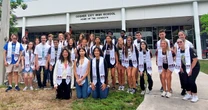 14 sets of twins and one set of triplets graduate from the same high school class 