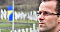 He survived a mass execution at 17. Now he's fighting disinformation and denialism.