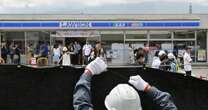 Swarmed with tourists, Japan town blocks off viral view of Mt. Fuji