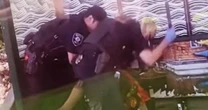 2 police officers under investigation after they were recorded beating a man with batons at a bus stop