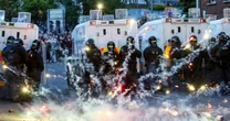 Northern Ireland town is engulfed in racist riots for a third day