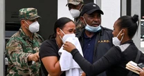 Dominican families plead for remains of relatives killed in roof collapse amid autopsy backlogs