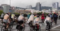 In Portland, nude cyclists join anti-ICE protests in rain-soaked ride