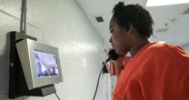 Denied the 'right to hug': In many U.S. jails, video calls are the only way detainees can see loved ones