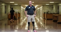 A double amputee who served in Iraq is pushing lawmakers to end the 'wounded veterans tax'