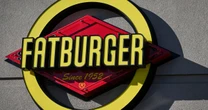 Fatburger parent company, chairman charged in alleged fraud scheme
