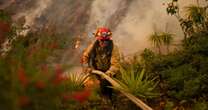 Firefighters battle to contain L.A. fires as Santa Ana winds are forecast to pick back up