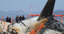 Grieving relatives set up tents in airport as they wait for news of loved ones in South Korea plane crash