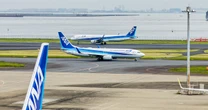 Marine says he tackled 'unruly' man accused of trying to open exit door on international flight