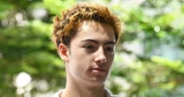 French teen charged in Singapore over a vending machine straw-licking video