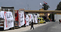 Hundreds of trucks full of aid sit idle near border with Gaza as crisis deepens