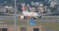 Flight departing from Boston puts on the brakes after spitting out flames