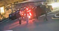 Cornell president accused of backing car into protester says he was victim of 'harassment' 