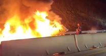 Single-engine plane with 2 passengers bursts into flames after crashing into North Carolina freeway