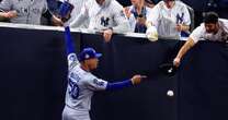 Yankees fan grabs Mookie Betts' glove trying to pry ball loose in World Series