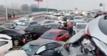 Several injured in 100-car pile-up on icy overpass in China