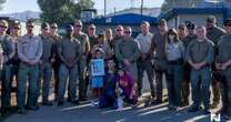 ‘We’re a family’: LA first responders escort children of late colleague to first days of school