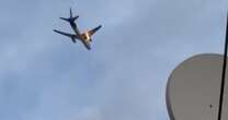 Videos show FedEx cargo plane's engine on fire mid-flight