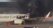 American Airlines plane catches fire at Denver International Airport