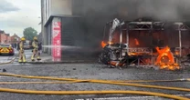 Protesters set fire to bus as unrest continues after knife attack