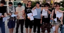 Israeli teenagers burn military draft papers in protest over Gaza war