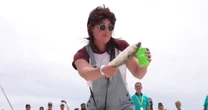 Thousands gather for annual Mullet Toss at iconic bar on Alabama-Florida state line
