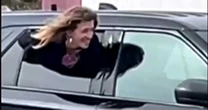 Michigan woman goes viral over Houdini-like escape from police cruiser