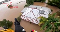 Video shows woman rescued from Australian floodwaters