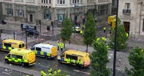 Emergency crews respond to reports a car hit pedestrians during Liverpool soccer parade