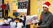 Watch: Obama makes surprise visit to Chicago school to read Christmas story