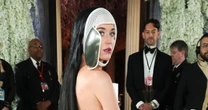 Katy Perry gives fans look behind mask