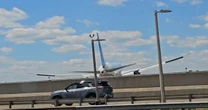 Driver on N.J. Turnpike hurt as United plane hits pole on approach to Newark airport
