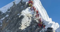 Hundreds of hikers summit Mt. Everest in record-smashing season