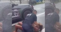 Altercation between parent and police officer over school parking caught on camera