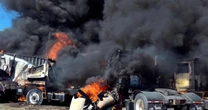Two killed when small plane crashes into parked tractor-trailers in Texas
