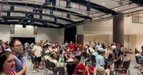 Watch: Salute to America event evacuees sing National Anthem