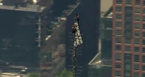 Trespassers climb to the top of the Empire State Building spire