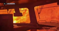Terrifying video of train trapped in wildfire