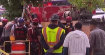 Rescuers search for contractors stuck in Illinois storm drain