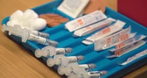 Covid cases and hospitalizations rise amid confusion over vaccine access