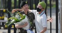 Jin greeted by BTS colleagues as he leaves South Korean army after national service