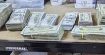 FBI searches home of defendant in fraud trial after being accused of bribing juror